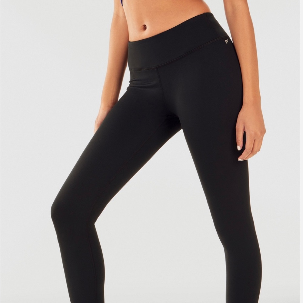 2 pair Fabletics Define Mid-rise capris! One black and one teal.